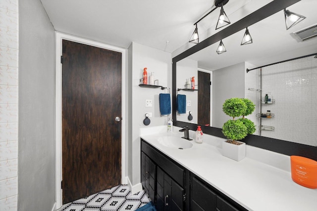 bathroom featuring vanity and a shower