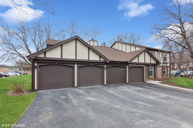 exterior space with a garage and a front yard