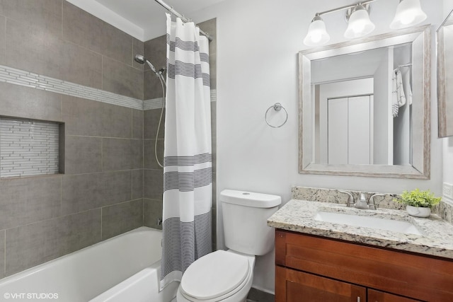 full bathroom featuring vanity, toilet, and shower / bath combo