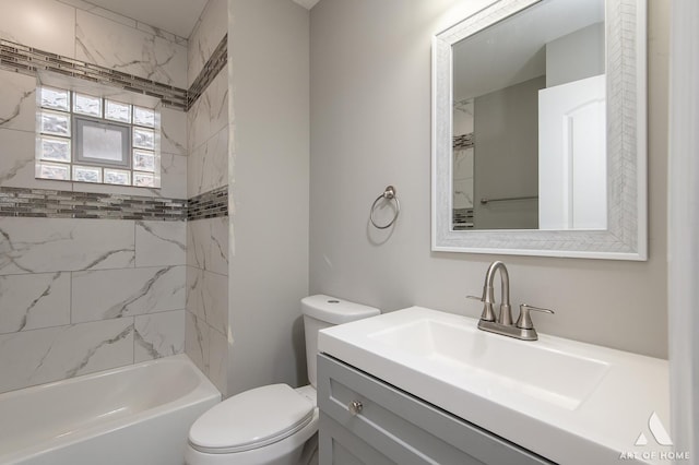 full bathroom featuring tiled shower / bath combo, vanity, and toilet