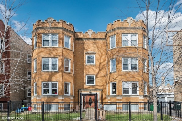 view of building exterior with a fenced front yard