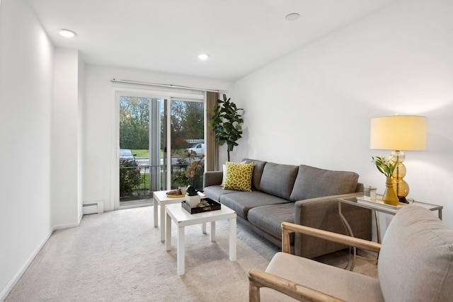 living room featuring light carpet and baseboard heating