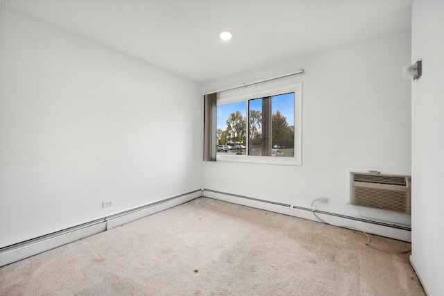 unfurnished room with a baseboard heating unit, carpet floors, and an AC wall unit