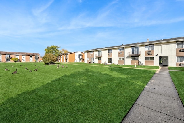 view of community featuring a yard