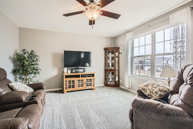 carpeted living room featuring ceiling fan