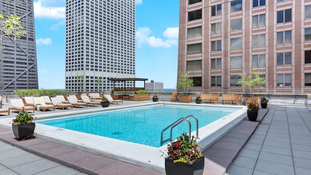 view of swimming pool with a patio area