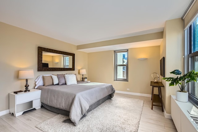 bedroom with light hardwood / wood-style floors