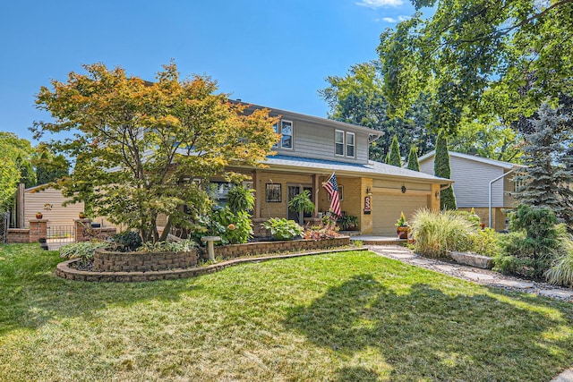 view of front property with a garage and a front lawn