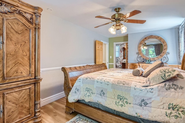 bedroom with ceiling fan and light hardwood / wood-style floors