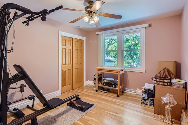 exercise area featuring ceiling fan and hardwood / wood-style floors