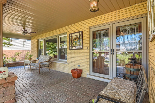 doorway to property with a patio area, french doors, and ceiling fan