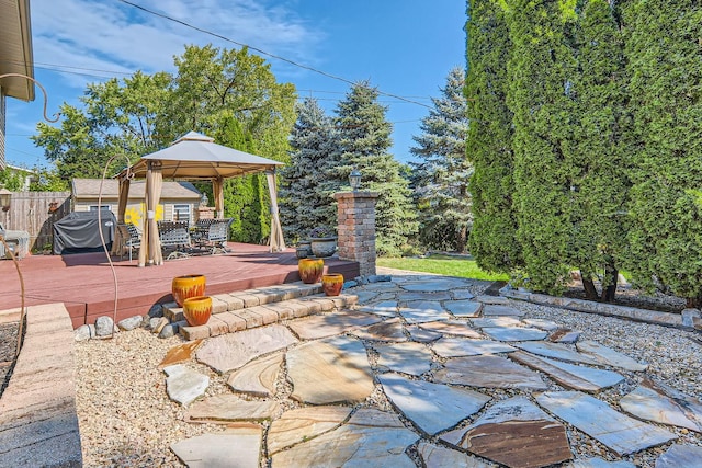 view of patio with a gazebo, grilling area, and a deck