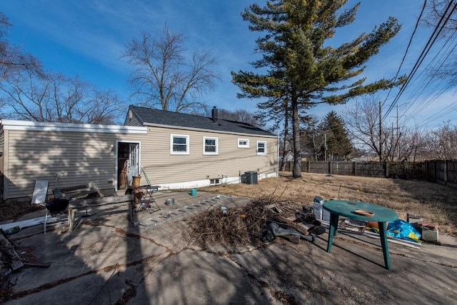 rear view of property featuring a patio area and central air condition unit