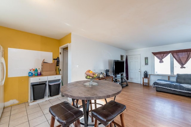 dining space with light wood-type flooring