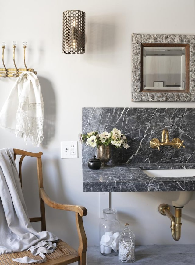 interior details with sink and decorative backsplash