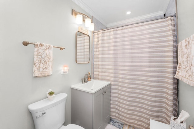 bathroom with vanity, ornamental molding, and toilet