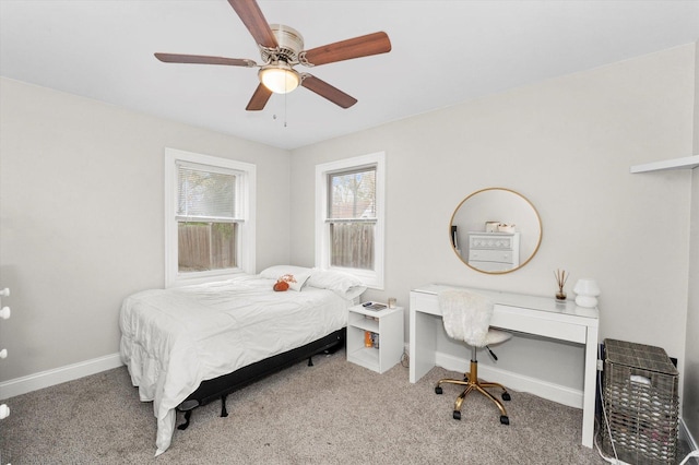 bedroom featuring ceiling fan and light colored carpet