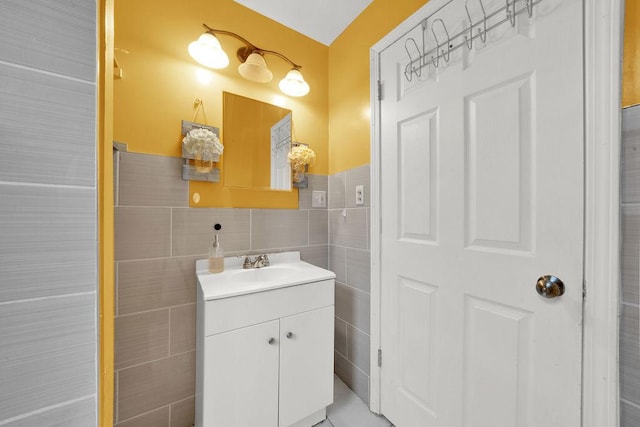 bathroom featuring tile walls and vanity