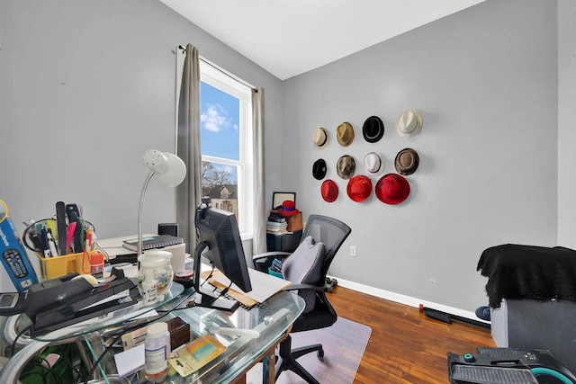 office space featuring wood finished floors and baseboards