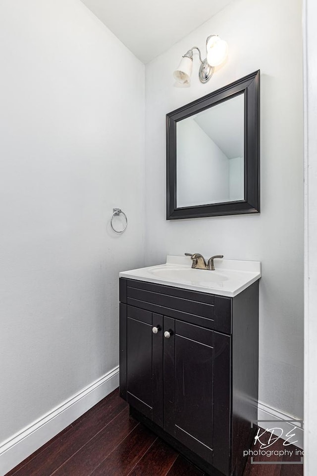 bathroom featuring vanity and hardwood / wood-style floors