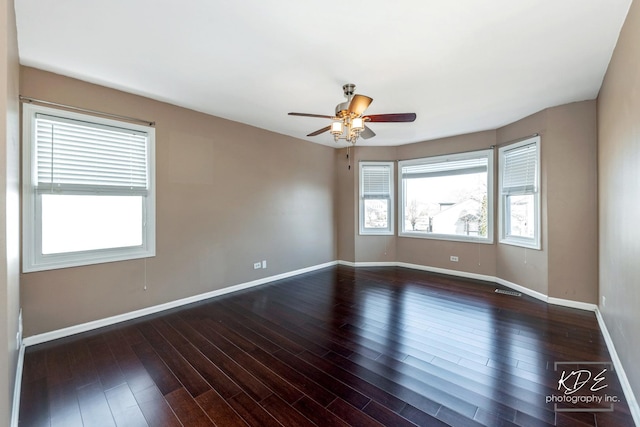 empty room featuring ceiling fan and wood-type flooring