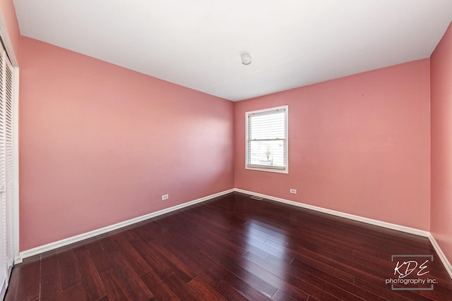 empty room featuring hardwood / wood-style flooring