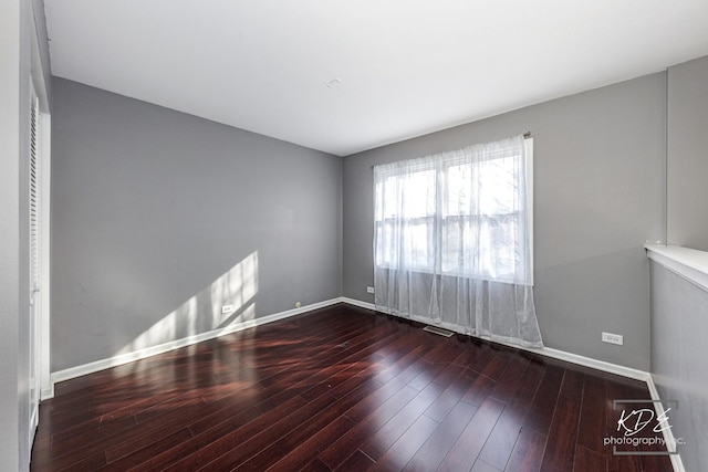 spare room featuring hardwood / wood-style floors