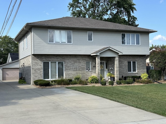 view of front of home with a garage, an outdoor structure, and a front yard