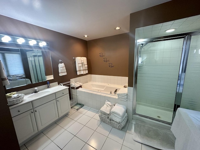 bathroom featuring vanity, tile patterned floors, and plus walk in shower