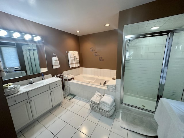 bathroom featuring tile patterned flooring, vanity, and plus walk in shower