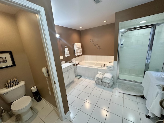 full bathroom with tile patterned flooring, vanity, independent shower and bath, and toilet