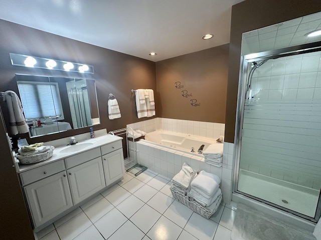 bathroom featuring vanity, shower with separate bathtub, and tile patterned flooring