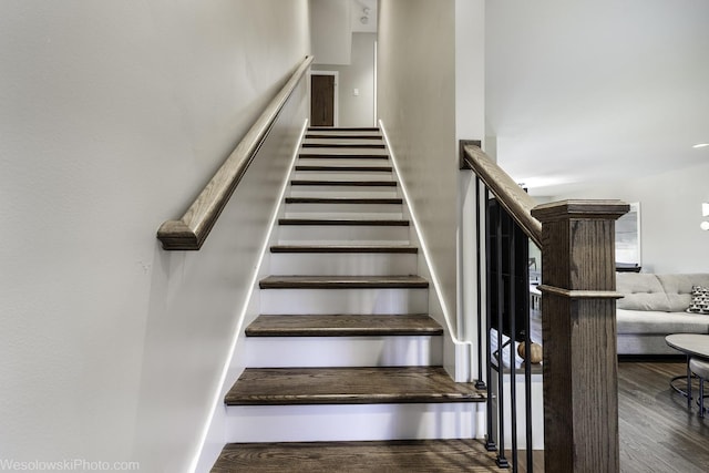 stairs with hardwood / wood-style floors