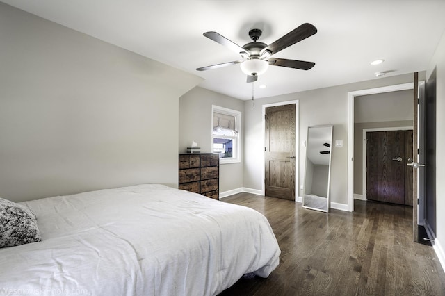 bedroom featuring ceiling fan and dark hardwood / wood-style floors