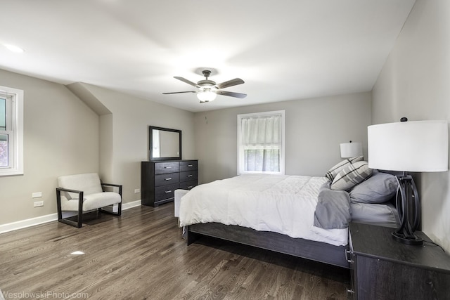 bedroom with dark wood-type flooring and ceiling fan