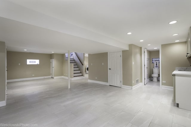 basement featuring washer / clothes dryer and sink