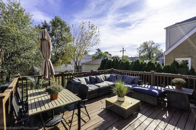 wooden deck with an outdoor hangout area