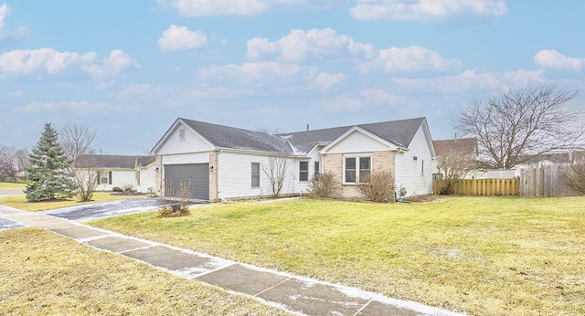 view of front of home with a garage and a front lawn