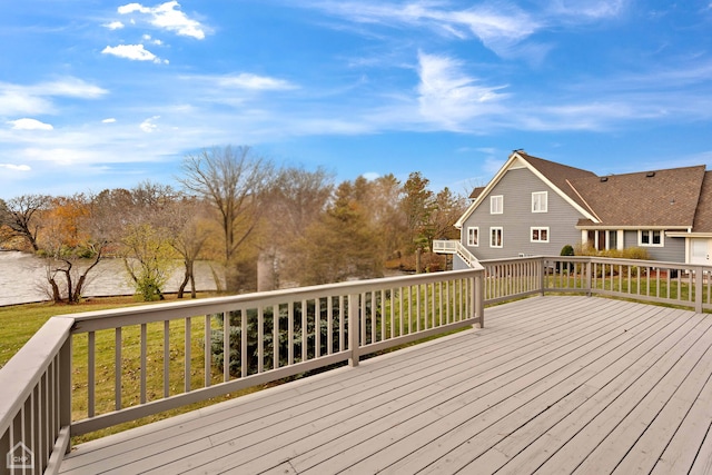 wooden deck with a water view