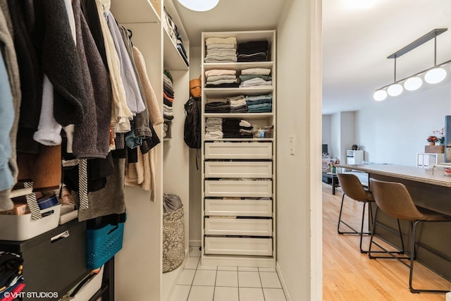 spacious closet featuring light wood-type flooring