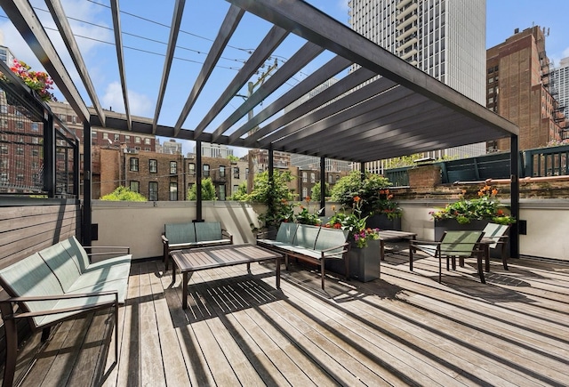 wooden deck with outdoor lounge area and a pergola