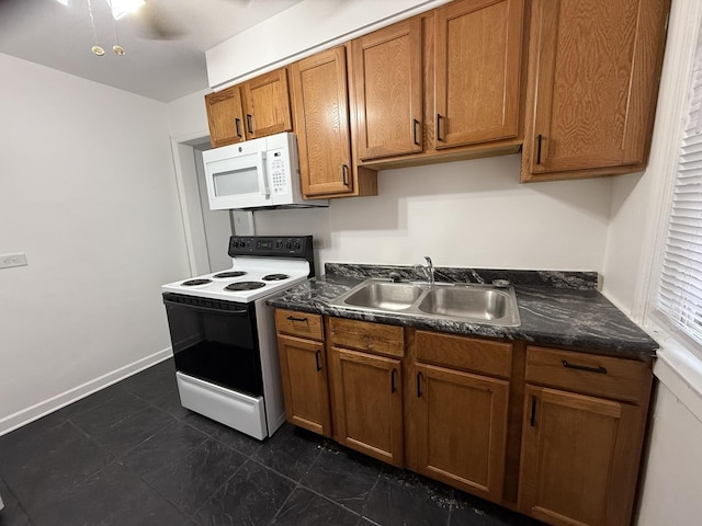 kitchen featuring range with electric cooktop and sink