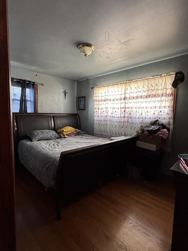 bedroom featuring wood-type flooring