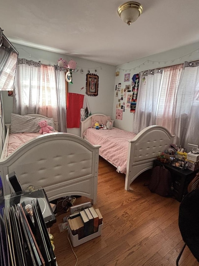 bedroom with wood-type flooring