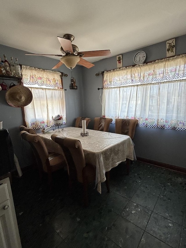 dining space featuring ceiling fan