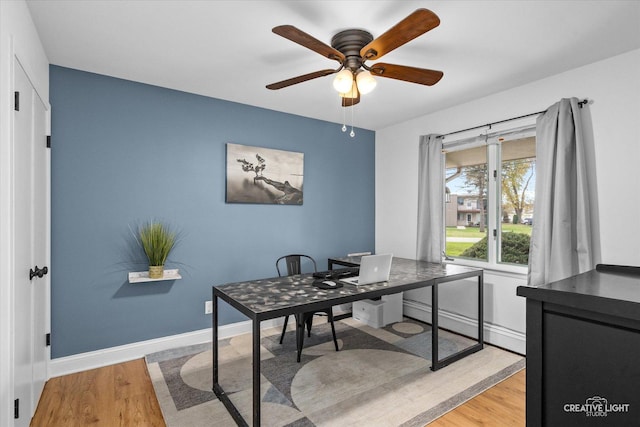 office space with ceiling fan and light wood-type flooring