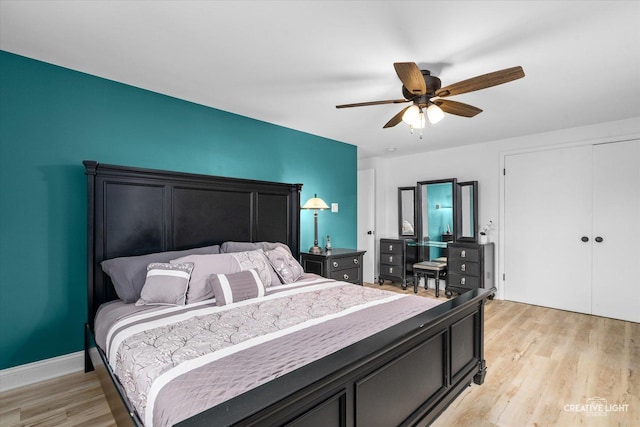 bedroom with ceiling fan and light hardwood / wood-style floors