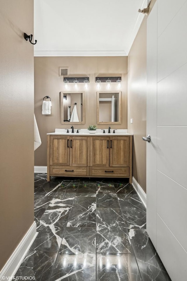 bathroom with vanity and ornamental molding