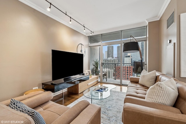 living room featuring hardwood / wood-style flooring, floor to ceiling windows, and crown molding