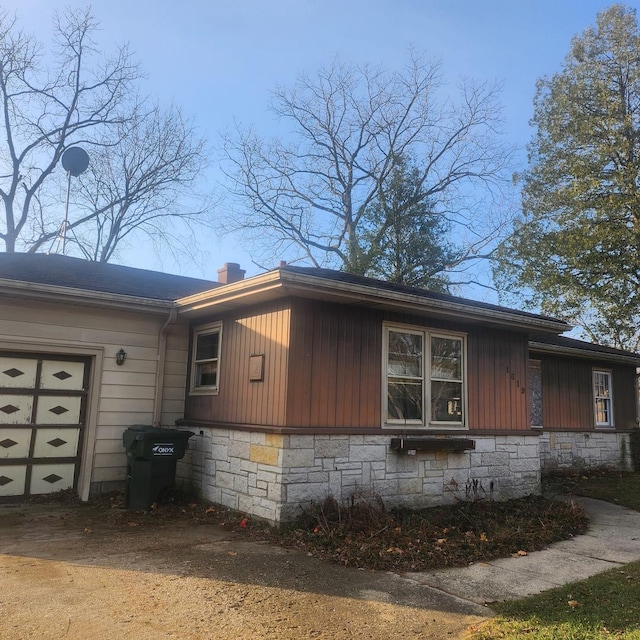 view of side of property featuring a garage